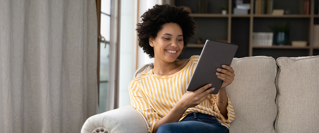 Woman viewing tablet device.